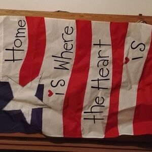 Flag with text home is where the heart is